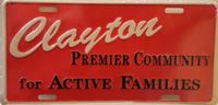 Clayton license plate reading, "Clayton: Premier community for active families"